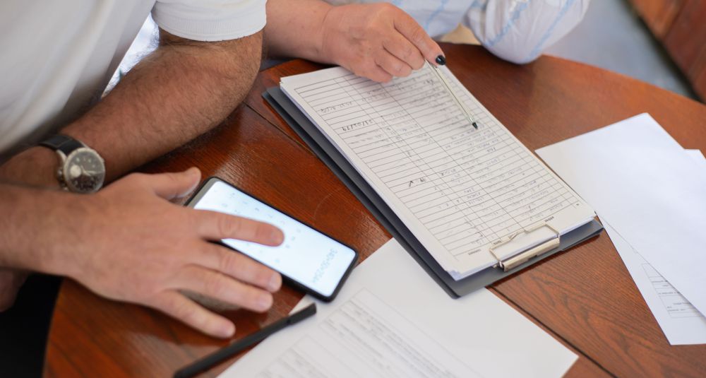pexels-kampus-7477690WEB_recordkeeping Photo by Kampus Production: https://www.pexels.com/photo/close-up-of-elderly-man-and-woman-sitting-at-the-table-with-documents-and-using-a-smartphone-7477690/